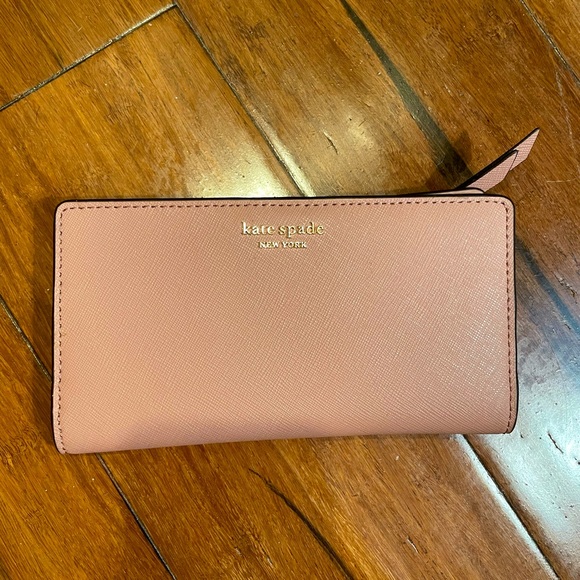 kate spade Handbags - Spencer Small Slim Bifold Wallet